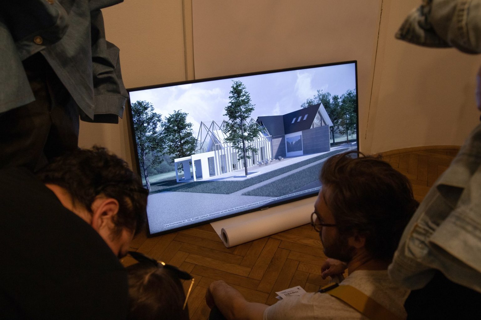 Na monitorze wyświetlany render budynku