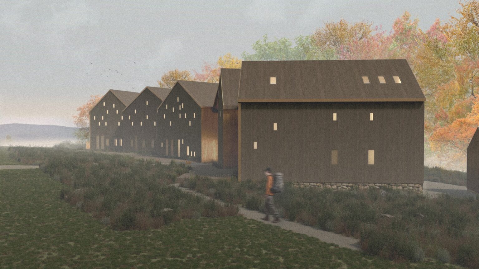 Schronisko to ciąg ciemnych, drewnianych budynków o prostych formach i nieregularnie rozmieszczonych oknach. Otoczone są naturalnym krajobrazem, z roślinnością i jesiennymi drzewami. Na pierwszym planie widoczny jest spacerujący człowiek.