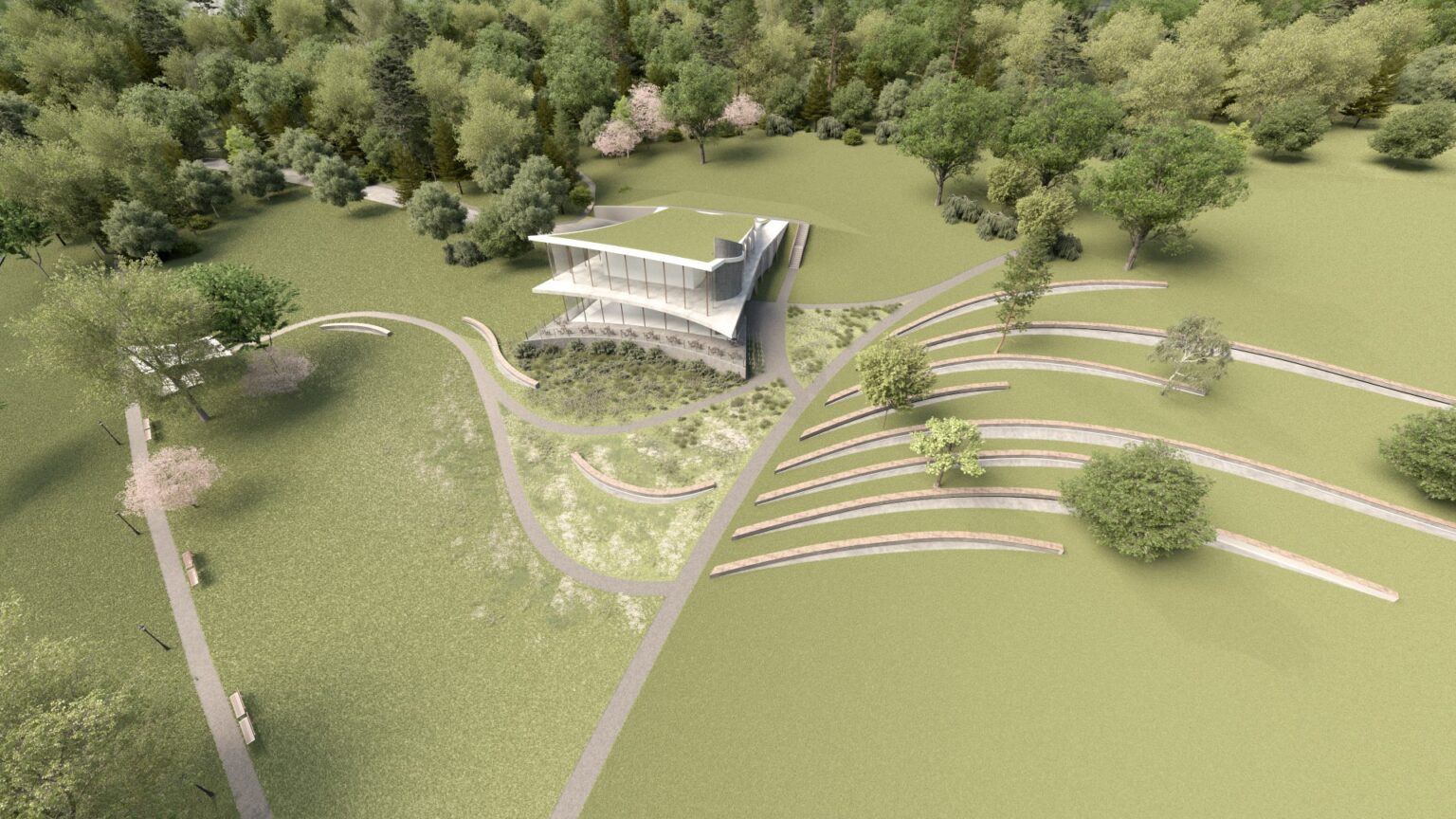 nowoczesny budynek restauracji wkomponowany w parkowy krajobraz. Otaczają go trawniki, drzewa i ścieżki, a także tarasowe ławki rozmieszczone półkolistymi rzędami. Budynek ma przeszkloną fasadę i zielony dach, harmonizując z otoczeniem.