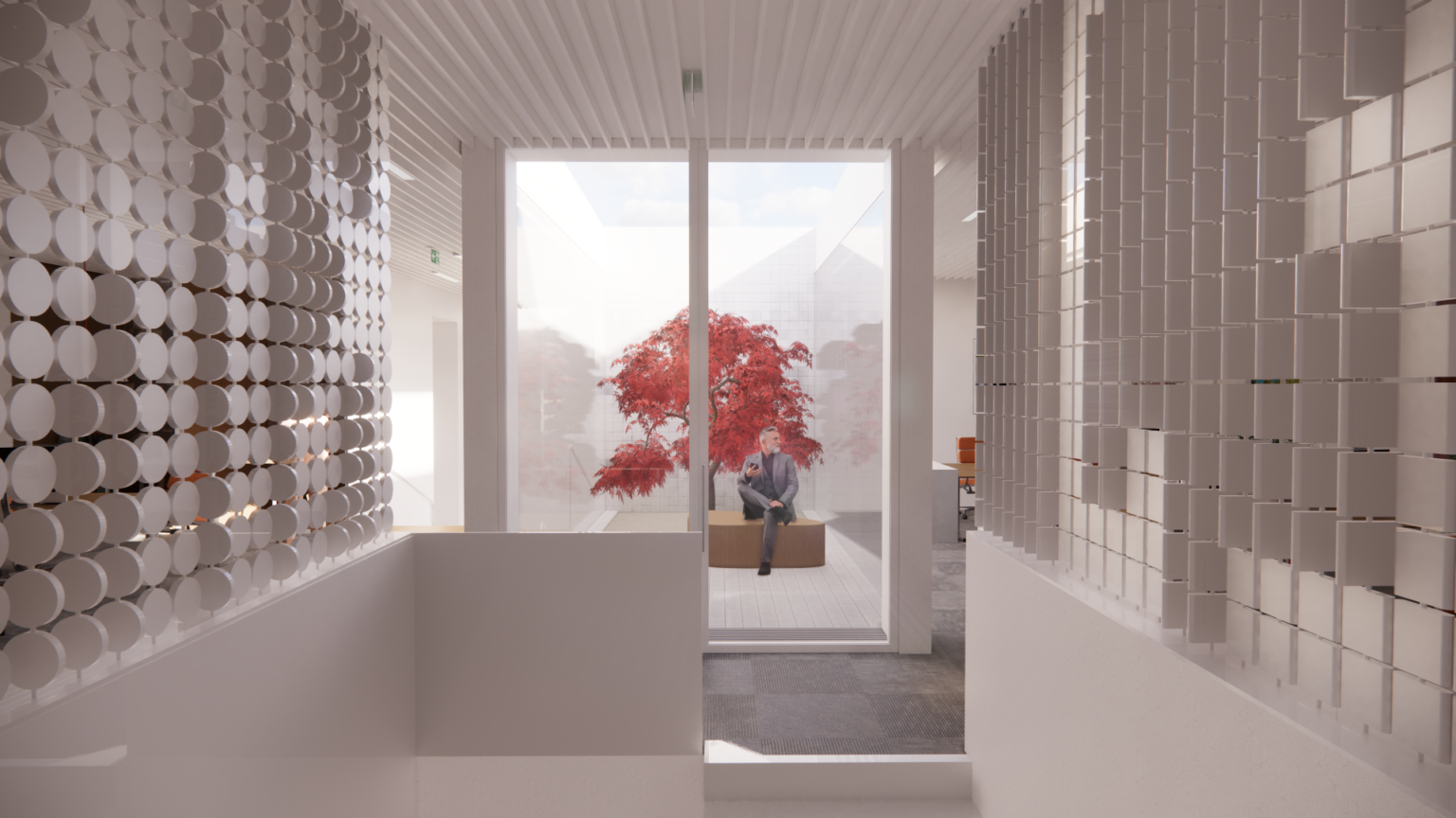 Przestrzeń biura dystrybucyjnego Kina Tęcza. Bardzo jasna, minimalistyczna przestrzeń. W centrum wnętrza jest świetlik z małym patio, którym zostało posadzone drzewo.