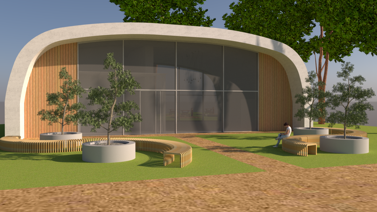 Nowoczesny budynek o organicznym kształcie z zaokrąglonym dachem i dużą przeszkloną fasadą. Elewacja łączy beton i drewno. Przed wejściem znajduje się zieleń z drzewami w donicach oraz ławkami o falistym kształcie. Całość tworzy przyjazne miejsce do odpoczynku i integracji społecznej.